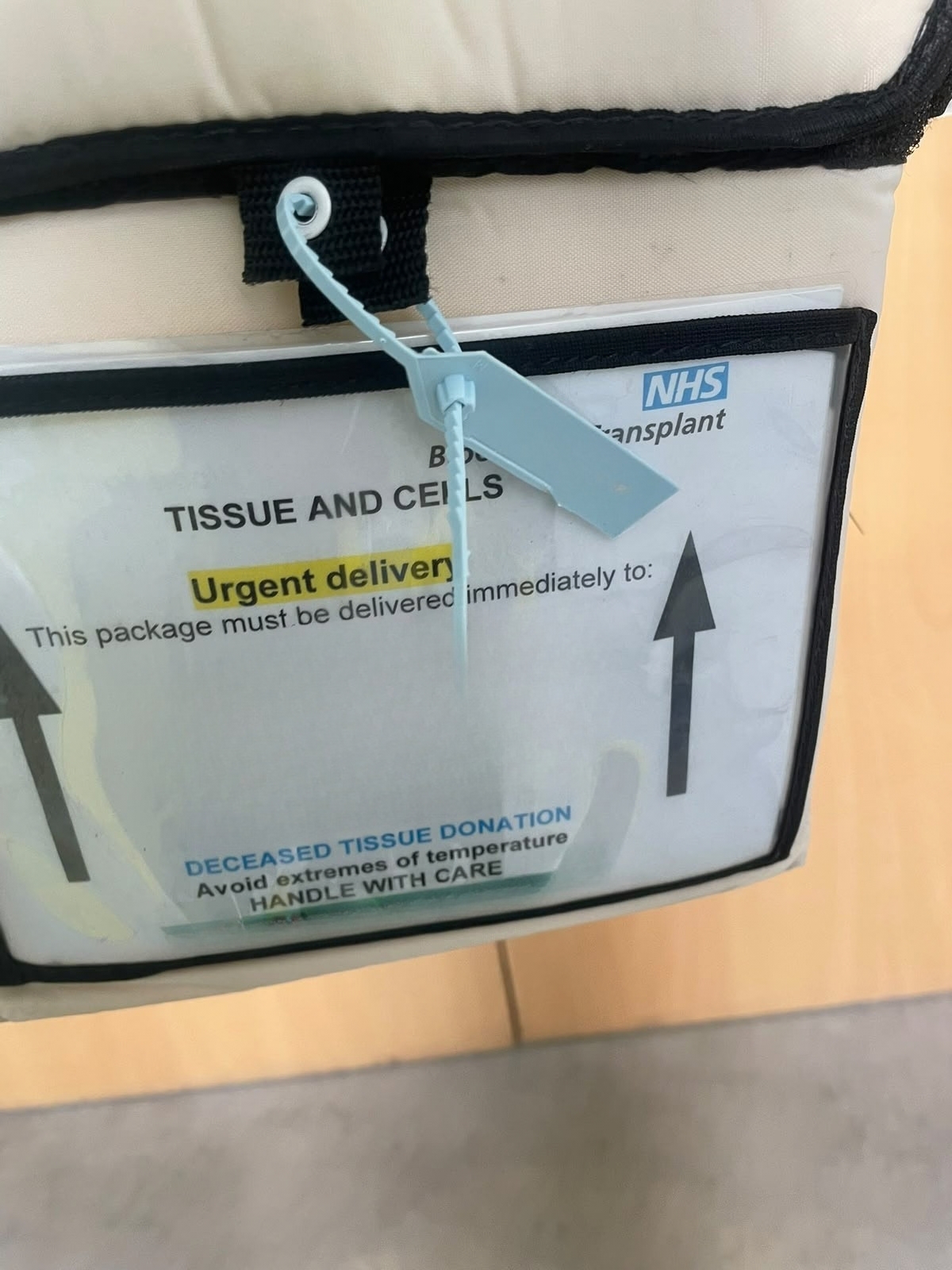 Sealed NHSBT tissue and cells consignment prepared for urgent courier transport under chain of custody